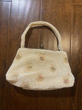 Corde Bead ivory and flower twist top handbag